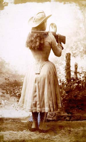 Expert Markswoman Annie Oakley performing her famous mirror trick