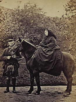 The recently widowed Queen Victoria wearing mourning clothes at Balmoral, Scotland, 1863. She is riding "Fyvie" and is accompanied by her faithful servant John Brown. Her husband, Prince Albert died in December of 1861 of typhoid fever or perhaps cancer of the stomach. For forty more years, the rest of Victoria's life, she wore black widow's weeds. Suspicion was aroused by Victoria's partiality to John Brown as a servant; most of the members of the Royal Household referred to him as "the Queen's stallion" and defamatory pamphlets referred to her a "Mrs. Brown." A 1997 film with Judy Dench titled "Mrs. Brown" was about the possible love affair.