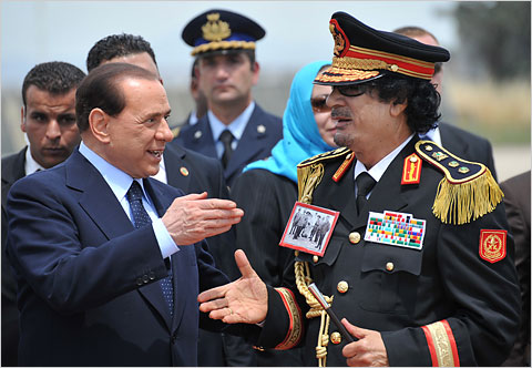 Italian Prime Minister Berlusconi greets Libyan leader Colonel Muammar Qaddafi, June 10, 2009, in Rome.