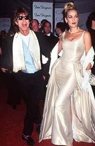 Mick Jagger and wife Jerry Hall. Hall filed for divorce from Jagger in 1992, calling him Jagger is a "lying, cheating, no-good slimeball." Jerry Hall is a Texas native.