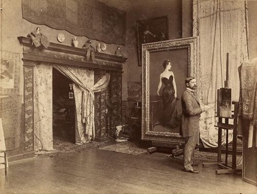 John Singer Sargent in Paris studio 1885 with the revised painting of Madame X