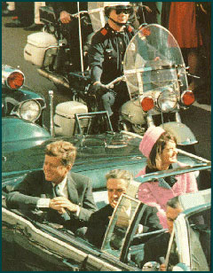 Jackie Kennedy in her pink Chanel suit and pillbox hat, riding through Dallas in a motorcade just minutes before a sniper kills her husband, President John F. Kennedy