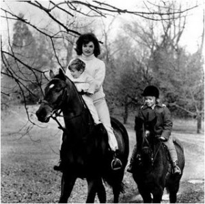 First Lady Jackie Kennedy riding horses with her children at their Middleburg, Virginia, retreat "Glen Ora." Jackie grew up surrounded by horses and was an accomplished equestrian. President John Kennedy did not share her passion for horse shows and riding. He was allergic to horse fur. November 19, 1962.