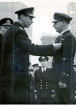 King George VI pins a Distinguished Service Medal on Chief Petty Officer C.L. Baldwin in December&nbsp;1939.