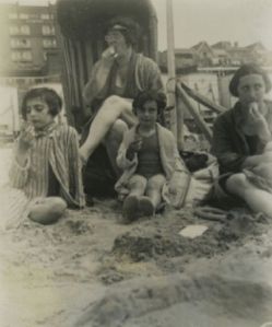 1934, Amsterdam. Margot, Anne, and their mother Edith Frank on the beach with Mrs. Schneider (back)