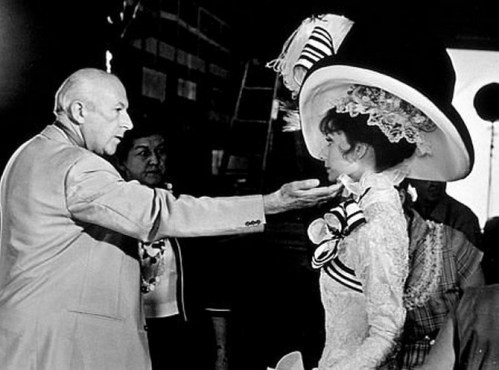 Art designer Cecil Beaton checks Audrey Hepburn's Ascot costume on the set of "My Fair Lady," 1963