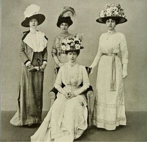 1911 Queen Mary with Ladies in Waiting. These women were not "Go-Ahead Girls"; they still wore the stiff collars of the Edwardians.