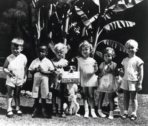 Shirley Temple (third from right) and her fellow castmates from Baby Burlesks in an ad for Baby Ruth candy bars, a stipulation in her contract with Educational Films Corporation. 1933/34