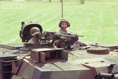 Former Massachusetts governor Mike Dukakis dons a helmet and drives a tank for a photo op. Sept. 13, 1988.