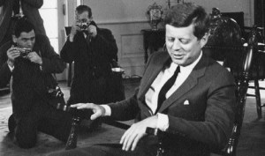 American photographer Stanley Tretick (l.) photographs President John F. Kennedy in the Oval Office, 1962. (Abbie Rowe, JFK Library and Museum)
