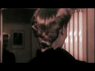 Veronica Lake shows her "victory roll" hairdo. 1942-43